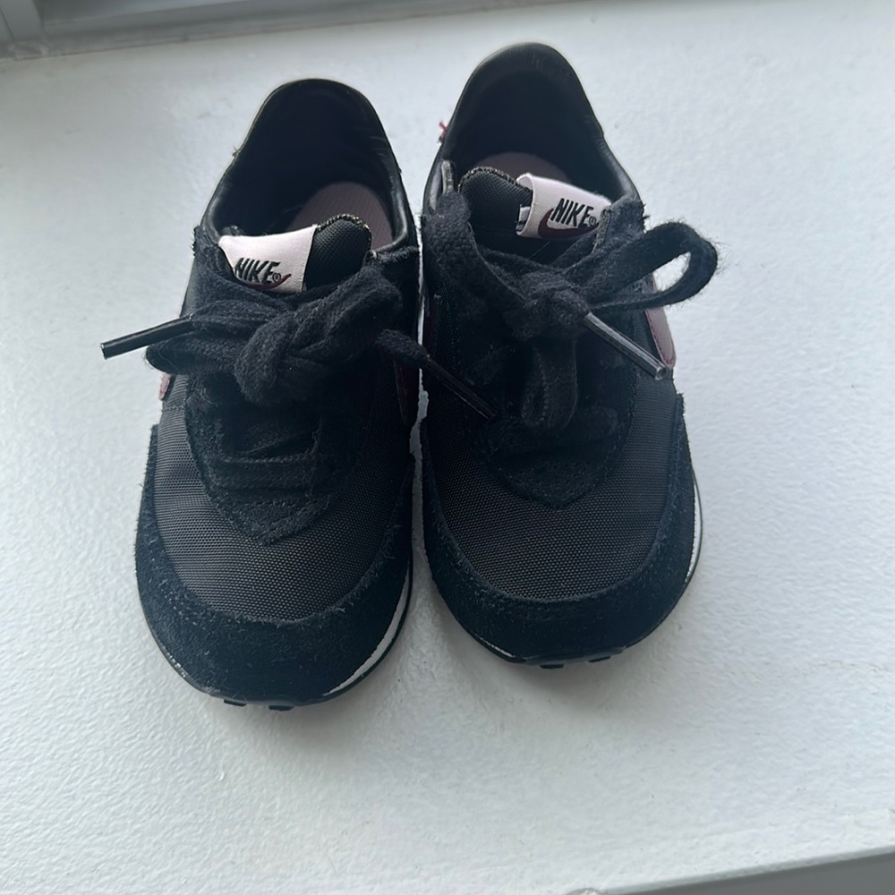 Baby Nike sneakers worn 4 times . In great condition
